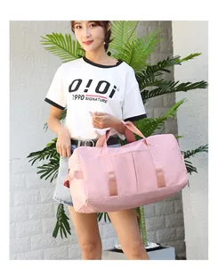Pink waterproof nylon duffel bag with dual zippers and woven handles for fitness yoga travel