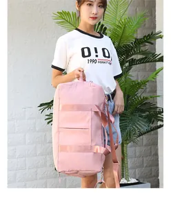 Detailed view of pink large capacity travel bag with adjustable strap and durable fabric