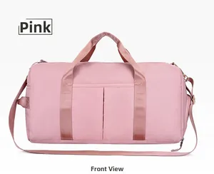 Front detail of pink waterproof travel bag showing reinforced handles and dual front pockets