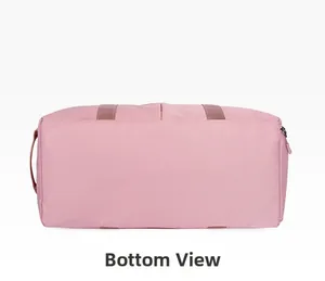 Detailed bottom view of pink sports duffel bag showing high-density nylon and neat stitching