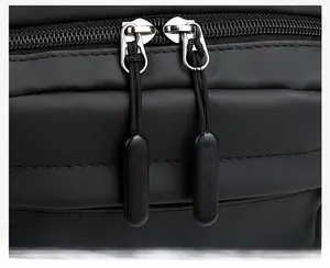 Macro shot of durable dual metal zippers with extended pullers on waterproof backpack