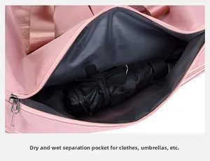 Pink travel bag detail showing wet dry separation pocket with waterproof gray lining