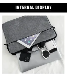 Layout interno della borsa per laptop grigia con spazio per tablet e accessori