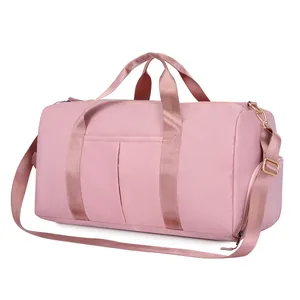 Detailed side view of pink large capacity travel bag with waterproof nylon and gold hardware