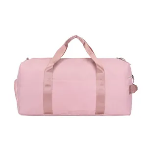 Detailed front view of pink nylon travel bag with dual handles and front storage pocket