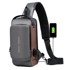 Detailed view of the USB charging port connected to a smartphone on a grey nylon sling bag