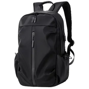 Waterproof black laptop backpack with USB charging port and vertical zipper front pocket