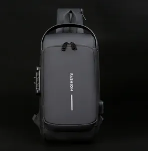 Detail of waterproof black crossbody bag showing anti-theft lock and USB charging port