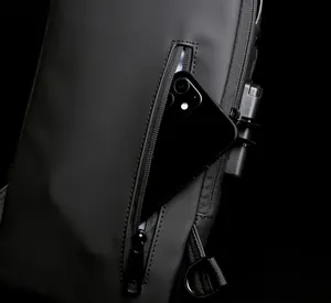 Close-up of matte waterproof nylon chest bag featuring a secure lock and smartphone pocket