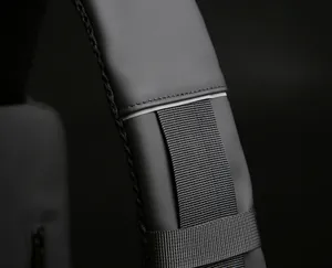 Close-up of durable shoulder strap with high-quality reflective edges and weave texture