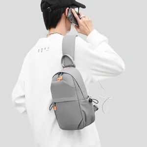 Grey tactical men's chest bag with USB charging port and adjustable shoulder strap