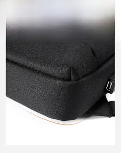 Close-up of black Oxford fabric corner with reinforced edges and built-in USB charging port