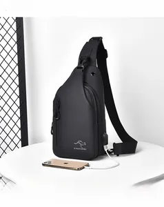 Detail view of black waterproof crossbody bag with integrated USB charging port for phone
