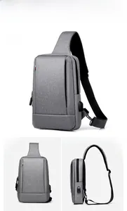 Detail view of light grey oxford sling bag featuring external USB charging port