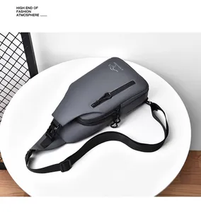 Detail view of water-resistant gray cross-body bag with vertical zipper on display stand
