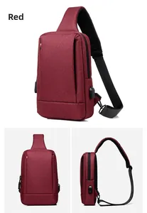Detail of red oxford sling bag featuring side USB charging port and adjustable strap
