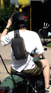 Detail view of the side USB charging port and waterproof fabric on this men's cross-body bag