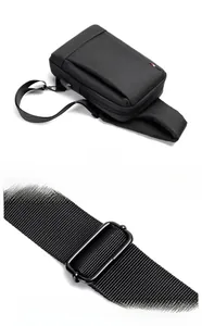Detail of men's oxford chest bag featuring a built-in USB charging port and metal buckle