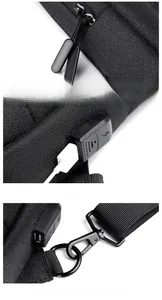 Macro detail of men's Oxford sling bag showing USB charging port and hardware zippers