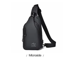 Detail of waterproof black men's chest bag showing USB port and kangaroo brand logo