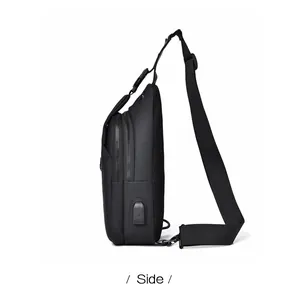 Detail view of water-resistant black sling bag with integrated USB charging port