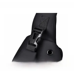 Close-up of durable black plastic buckle and nylon strap on waterproof crossbody chest bag
