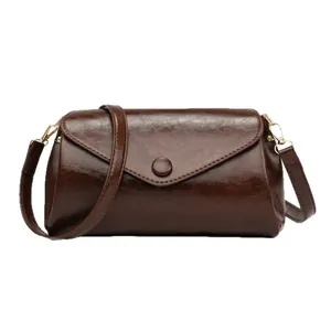 Dark brown faux leather crossbody bag with envelope flap and minimalist round buckle