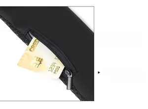 Detail of waterproof crossbody bag showing hidden card slot and gunmetal zipper slide