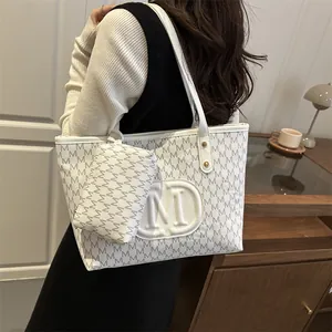 White PU leather tote bag with grey M-pattern print and shoulder straps for women