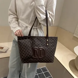 Brown PU leather tote bag set with monogram M pattern and matching pouch for women