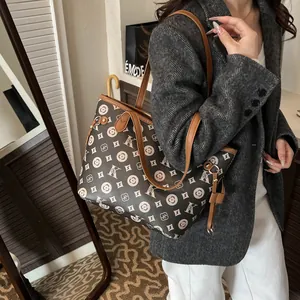 Retro monogram large tote bag for women featuring dark brown leather and twin handles