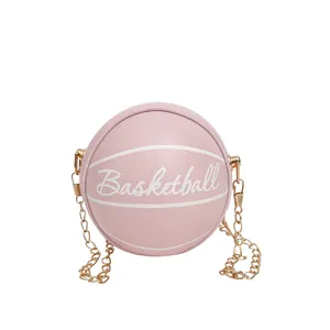 Chic pink basketball shaped crossbody bag with gold chain strap and textured finish