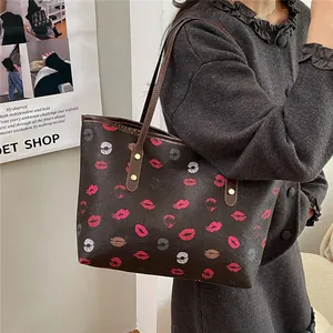Chic coffee-colored tote bag with vibrant lip patterns and textured faux leather finish