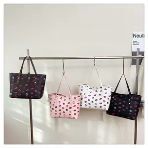 Group display of four colorful lip print tote bags hanging in different color options