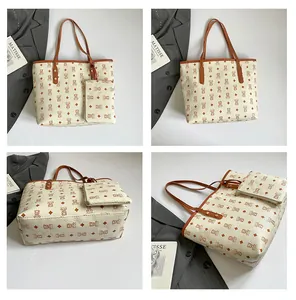 Detail view of printed tote bag with cartoon bear pattern and detachable inner pouch