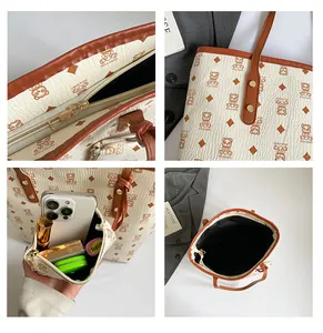 Detail view of large cream tote bag with litchi texture and matching inner pouch