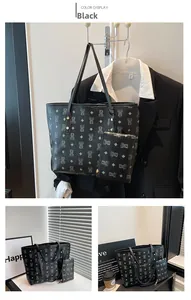 Detail of black tote bag set with bear pattern and matching pouch on a suit