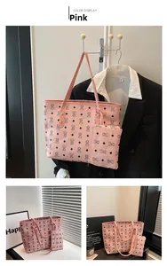 Detail of pink PU leather tote bag set with bear patterns and small matching pouch