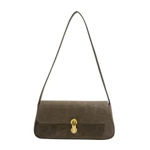 Brown leopard print rectangular baguette shoulder bag with gold buckle on white background