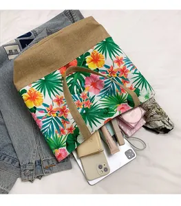 Detailed view of the spacious canvas tote bag with vibrant tropical floral pattern prints