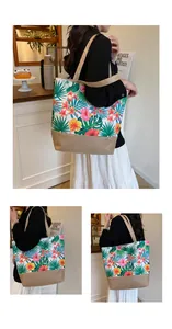 Detail view of large canvas tote bag featuring tropical floral print and jute patchwork