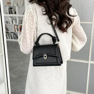 Minimalist black PU leather crossbody bag with knot handle and metal buckle for women