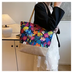 Detail of canvas tote bag with tropical flower prints and natural jute base