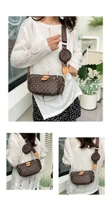 Close-up of brown monogram multi-piece crossbody bag with gold chain and wide strap