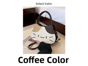 Detailed close-up of a tricolor cat-shaped crossbody bag with embroidery and leather strap