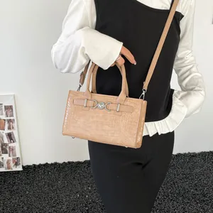 Beige crocodile embossed square handbag with silver metal buckle and adjustable strap