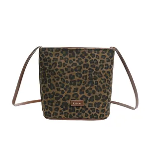 Vintage leopard print bucket bag with brown leather straps and FFDVI logo tag