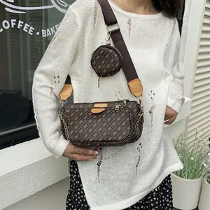 Fashionable brown monogram crossbody bag with wide canvas strap and round coin purse