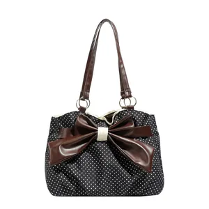 Polka dot tote bag with a large brown bow and lace detail for commuting women