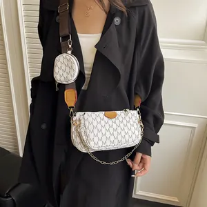 Chic 3-in-1 white crossbody bag with monogram print and golden chain strap